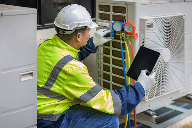 Professional Air Conditioning Repair technician working in Minier, IL
